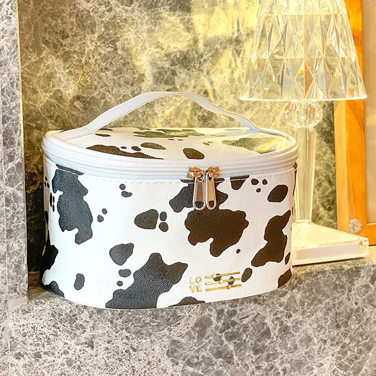 "Cow Print Waterproof Makeup Bag - Stylish and Compact Cosmetic Organizer for Women"